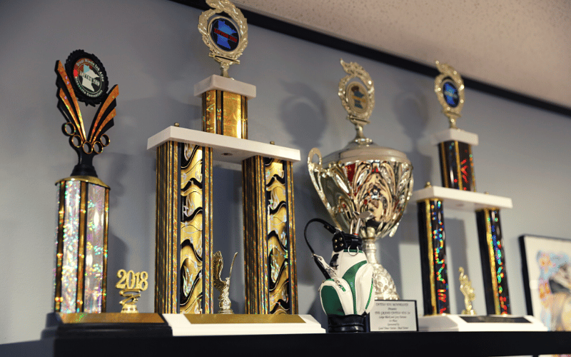 trophies on a shelf in the studio